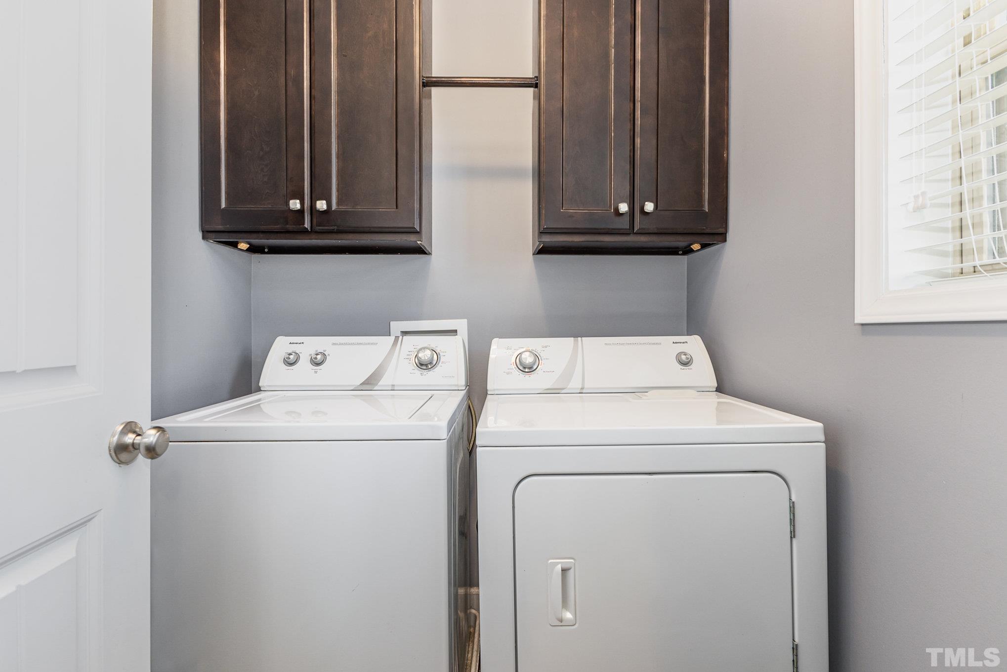 1604 Hauser Lake Road Knightdale, NC 27545 - Photo 26 of 32 a utility room with dryer and washer