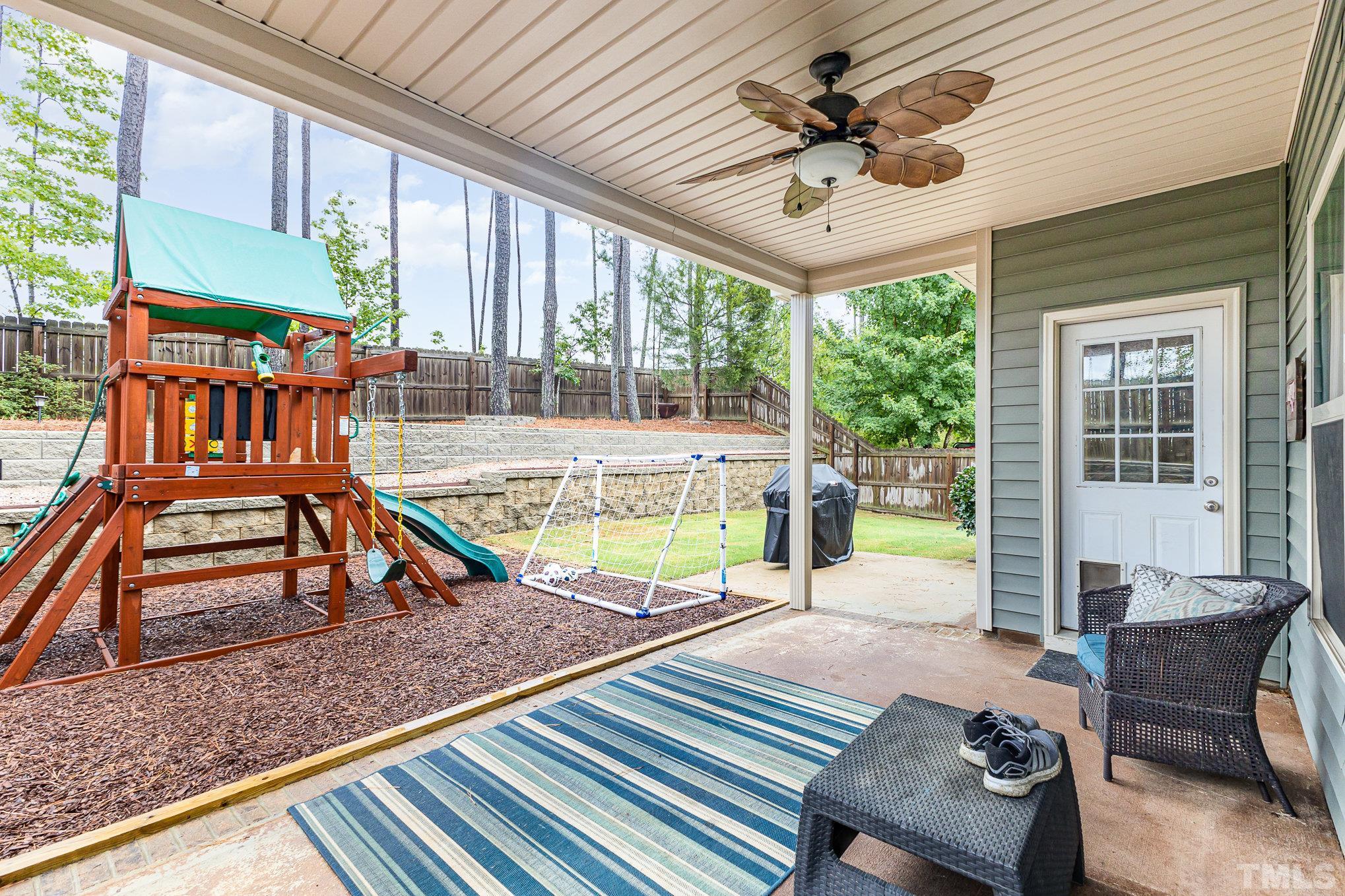 1604 Hauser Lake Road Knightdale, NC 27545 - Photo 27 of 32 a view of a patio with a table chairs and a patio