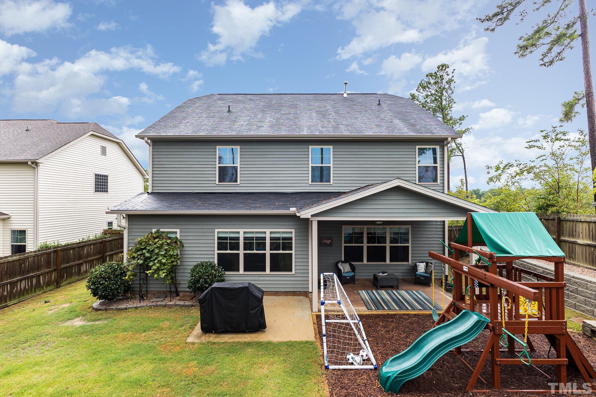 1604 Hauser Lake Road Knightdale, NC 27545 - Photo 28 of 32 a view of a house with a yard and sitting area