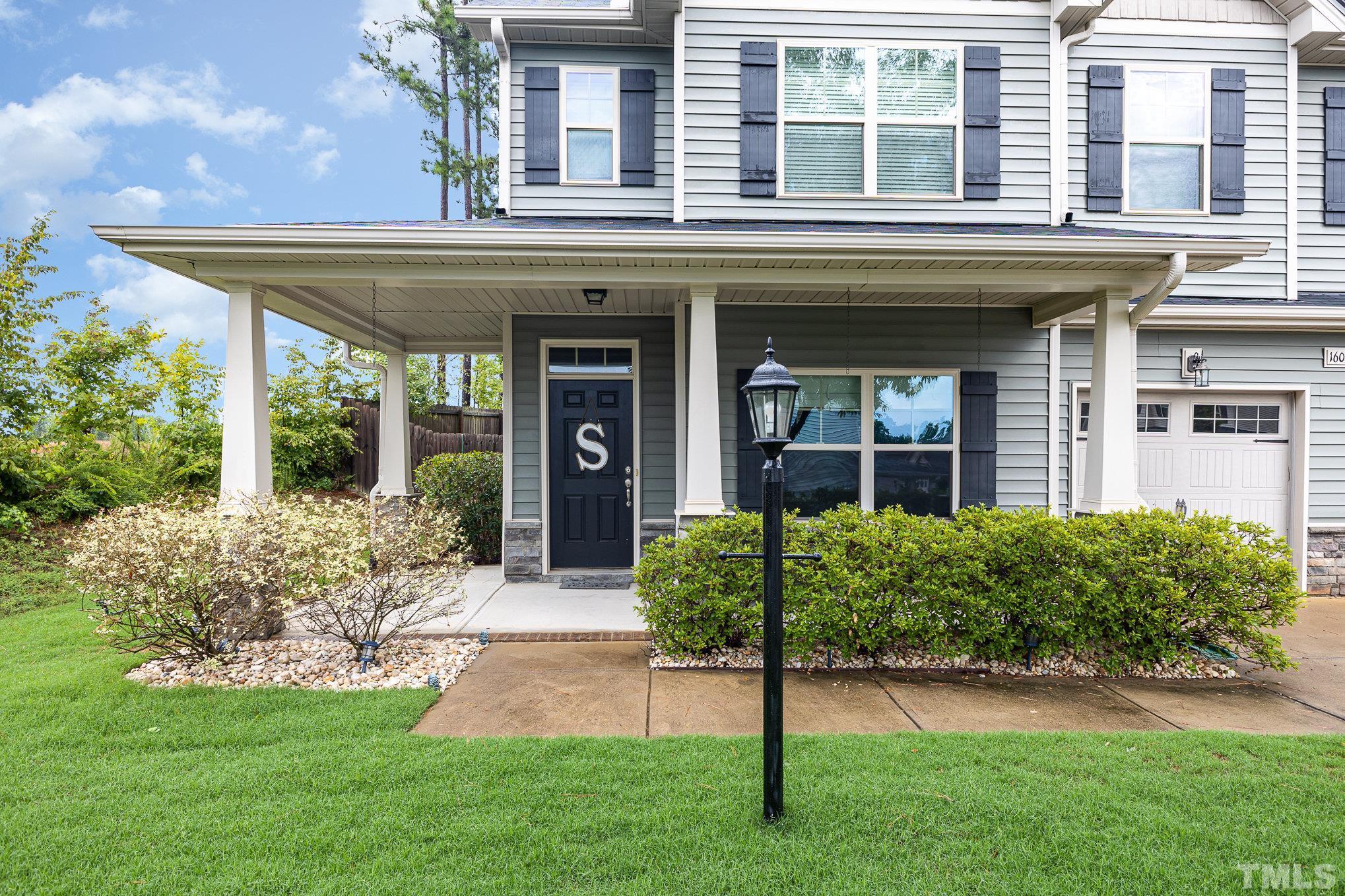 1604 Hauser Lake Road Knightdale, NC 27545 - Photo 4 of 32 front view of a brick house with a yard