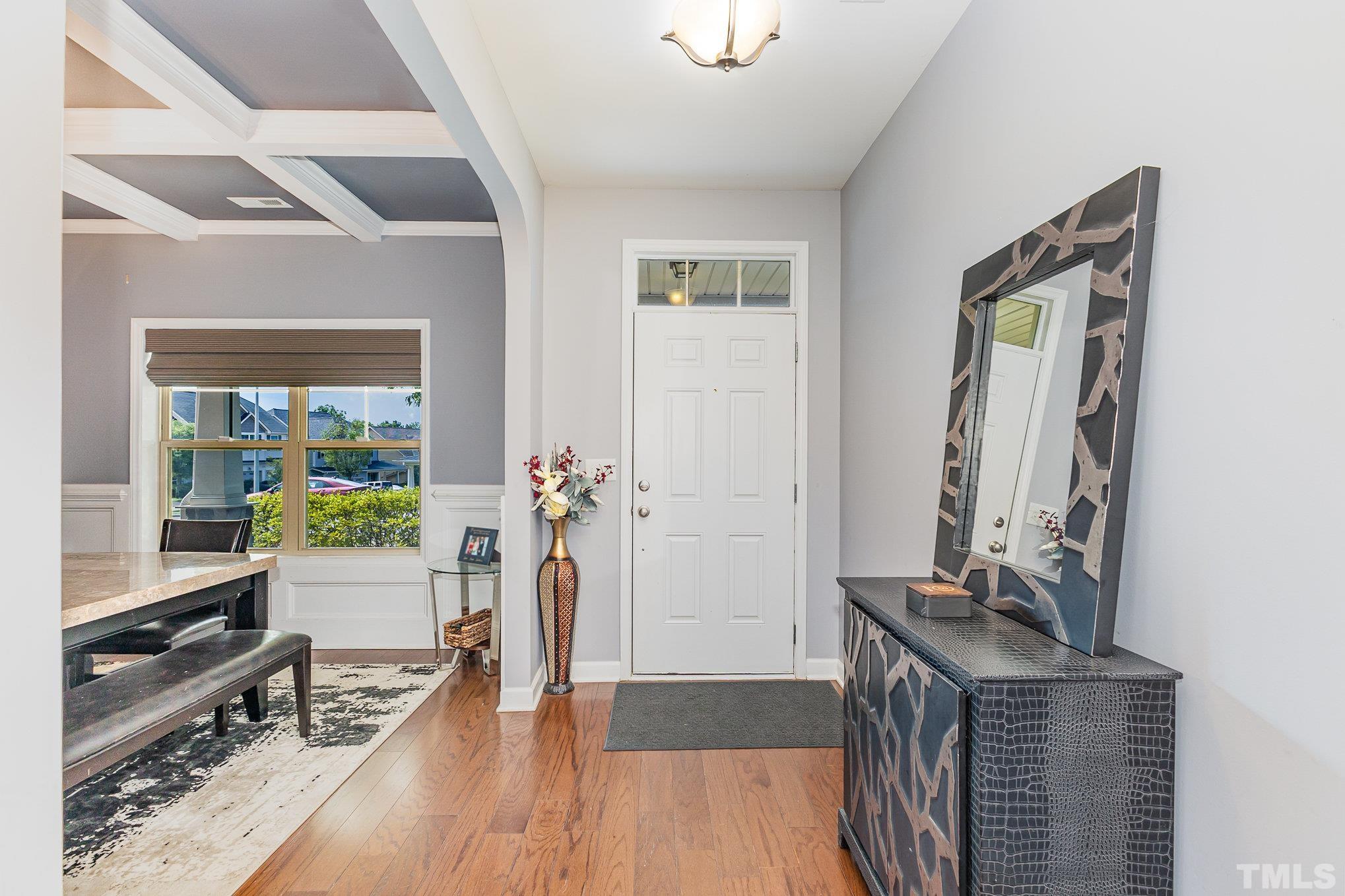 1604 Hauser Lake Road Knightdale, NC 27545 - Photo 5 of 32 a view of a hallway with workspace and living room