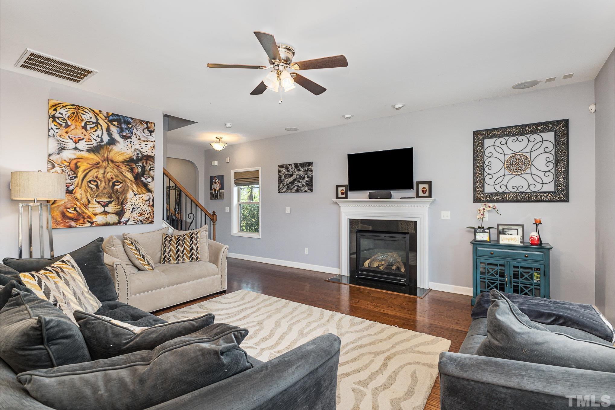 1604 Hauser Lake Road Knightdale, NC 27545 - Photo 9 of 32 a living room with furniture and a fireplace