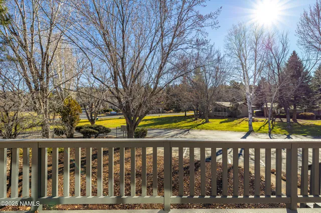 a view of swimming pool with swimming pool and wooden fence