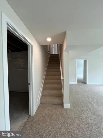 a view of entryway with stairs and wooden floor