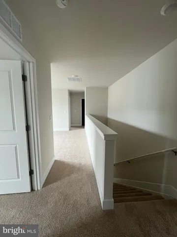 an empty room with a fireplace