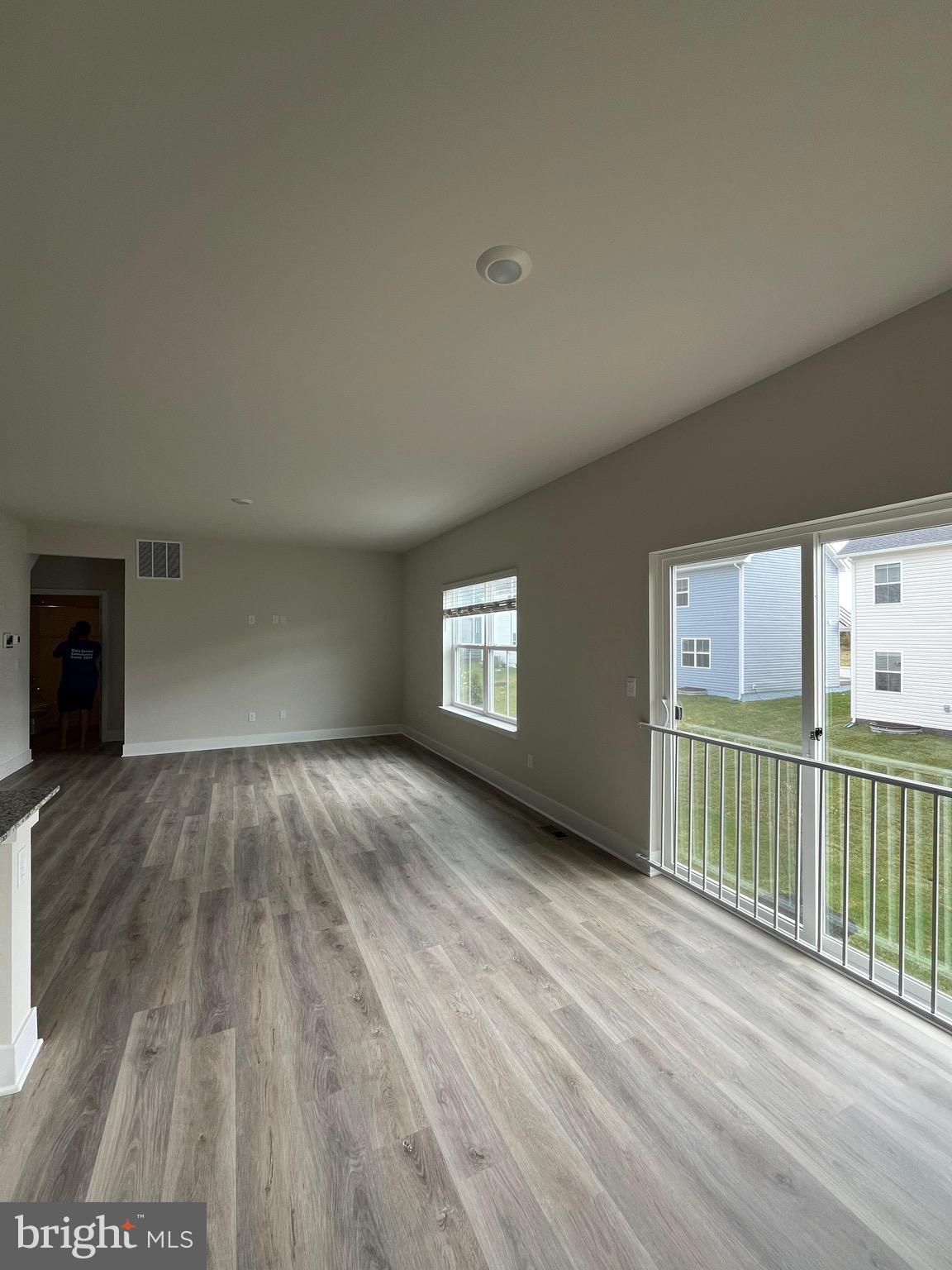 117 Manasquan Way Winchester, VA 22602 - Photo 31 of 34 an empty room with wooden floor and windows