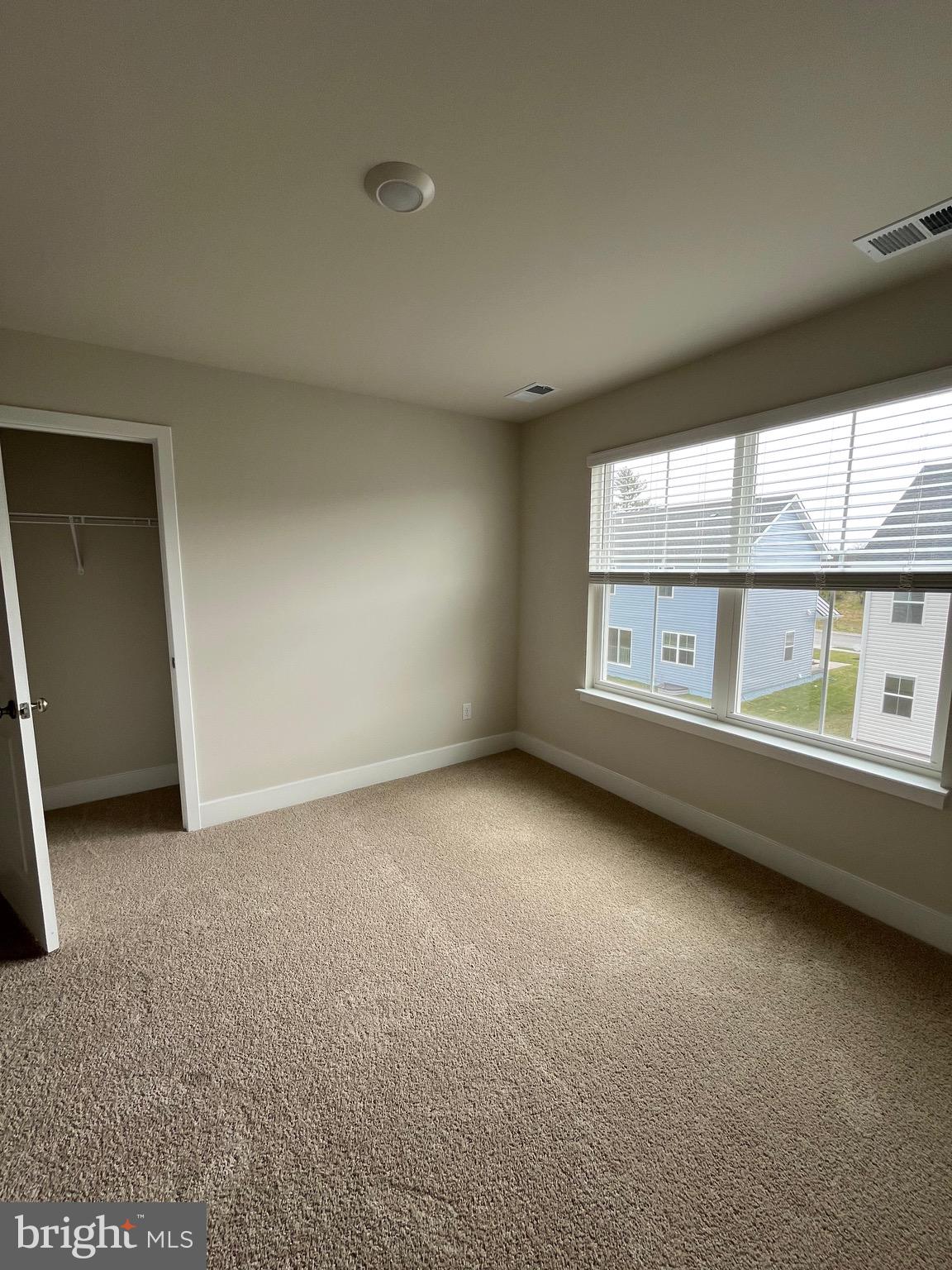 117 Manasquan Way Winchester, VA 22602 - Photo 5 of 34 an empty room with windows