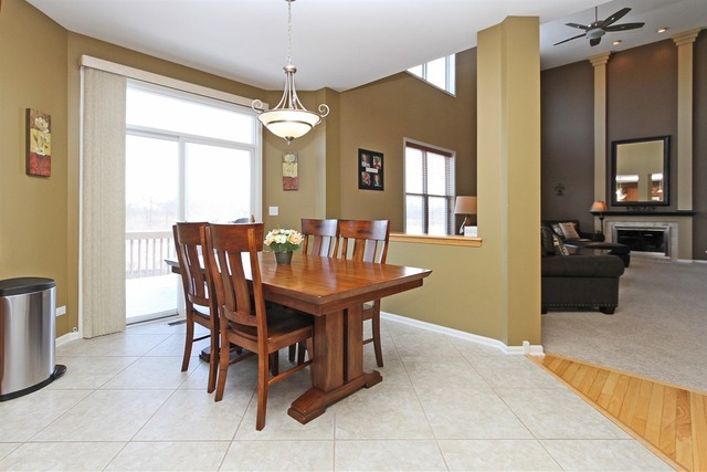 1561 Southgate Road Bartlett, IL 60103 - Photo 14 of 25 a view of a dining room with furniture and a chandelier