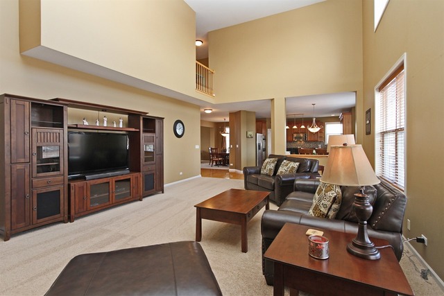 1561 Southgate Road Bartlett, IL 60103 - Photo 17 of 25 a living room with furniture and a flat screen tv