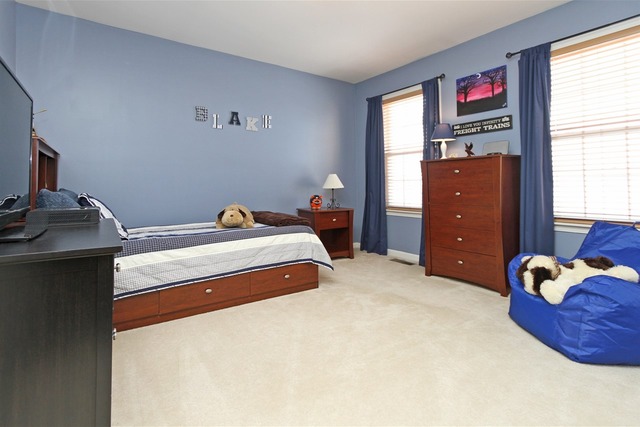 1561 Southgate Road Bartlett, IL 60103 - Photo 22 of 25 a bedroom with a bed and a window