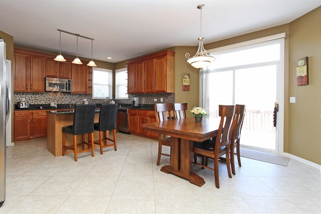 1561 Southgate Road Bartlett, IL 60103 - Photo 5 of 25 a view of a dining room with furniture window and outside view