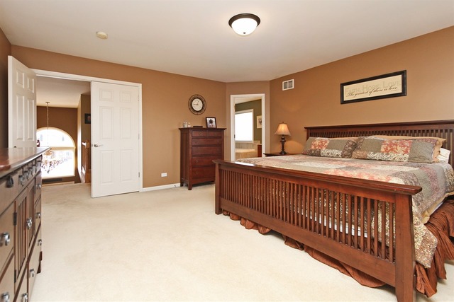1561 Southgate Road Bartlett, IL 60103 - Photo 7 of 25 a bedroom with furniture and a window