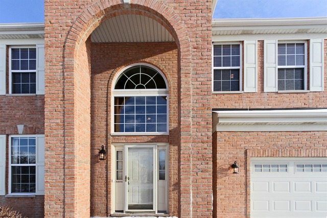 1561 Southgate Road Bartlett, IL 60103 - Photo 8 of 25 a front view of a house with glass windows