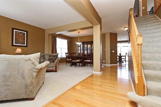 1561 Southgate Road Bartlett, IL 60103 - Photo 10 of 25 a living room with furniture and a wooden floor