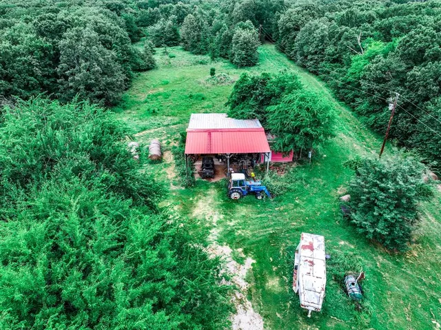 a view of a back yard with an umbrella