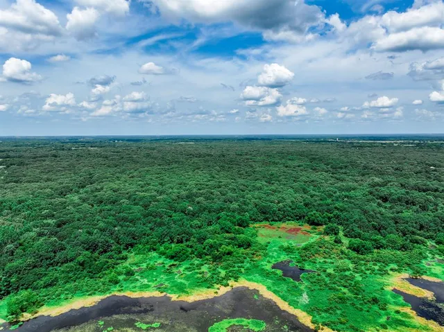 a view of outdoor space with table and chairs