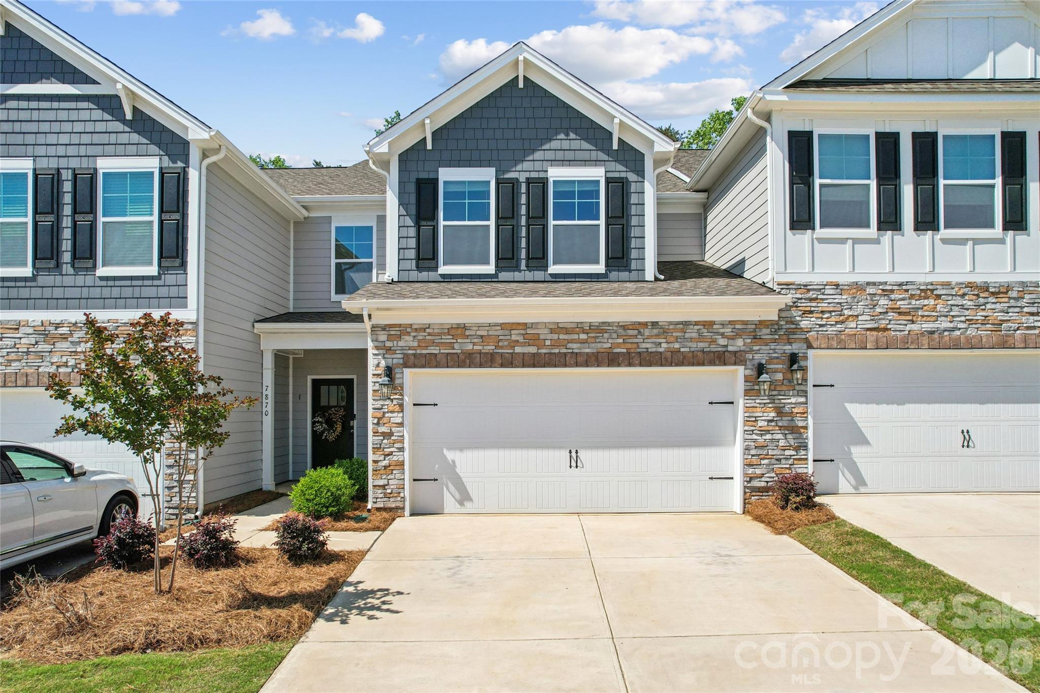 7870 Iron Road Sherrills Ford, NC 28673 - Photo 1 of 42 a front view of a house with garden