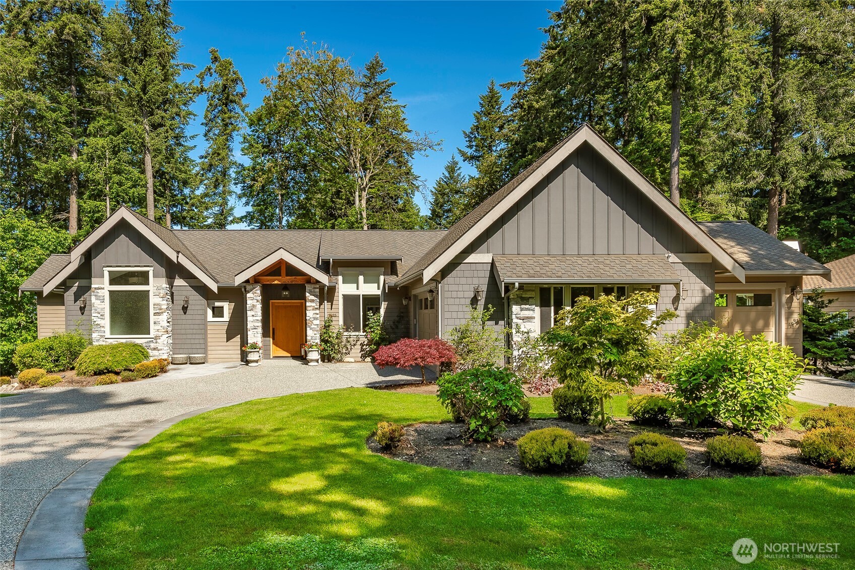 9125 Shearwater Road Blaine, WA 98230 - Photo 3 of 40 a front view of a house with a yard and potted plants