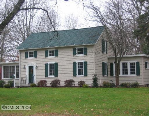 48 Gilbert Street Ridgefield, CT 06877 - Photo 1 of 1 a front view of a house with a garden