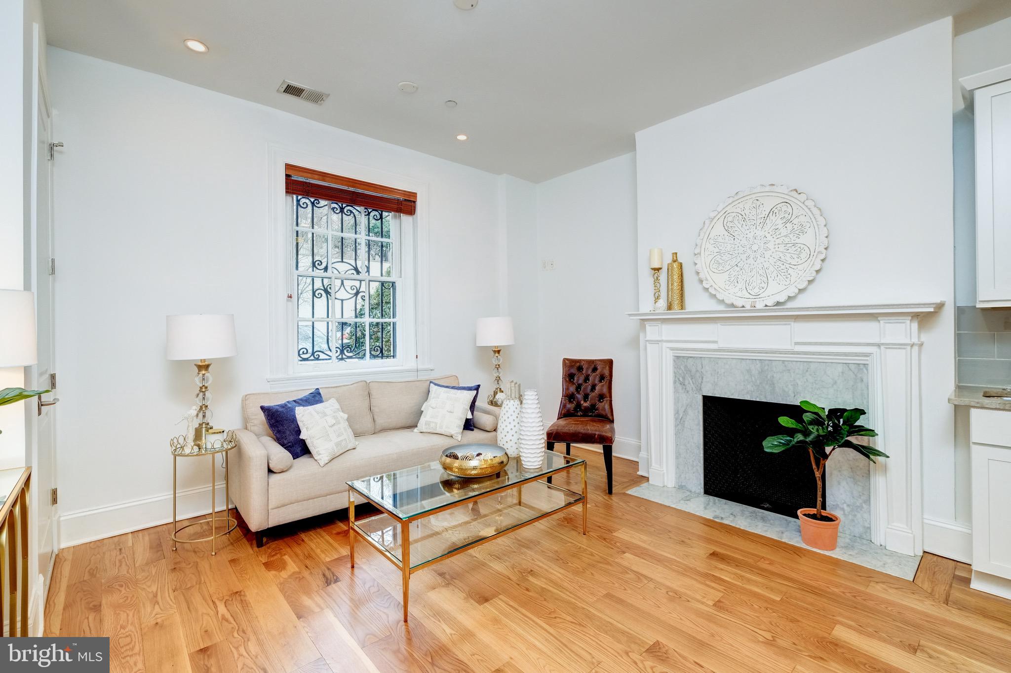 1929 19th Street Northwest, Unit 1 Washington, DC 20009 - Photo 7 of 21 Featuring tall ceilings, wood-burning fireplace,