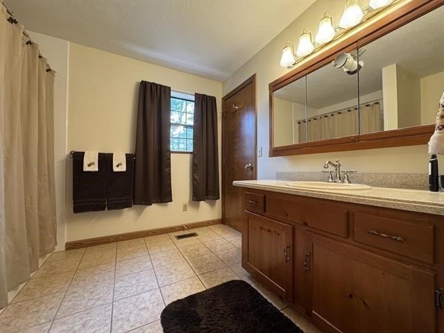 43 West Meadow Road, Unit 43 Haverhill, MA 01832 - Photo 34 of 42 a bathroom with a sink and a mirror