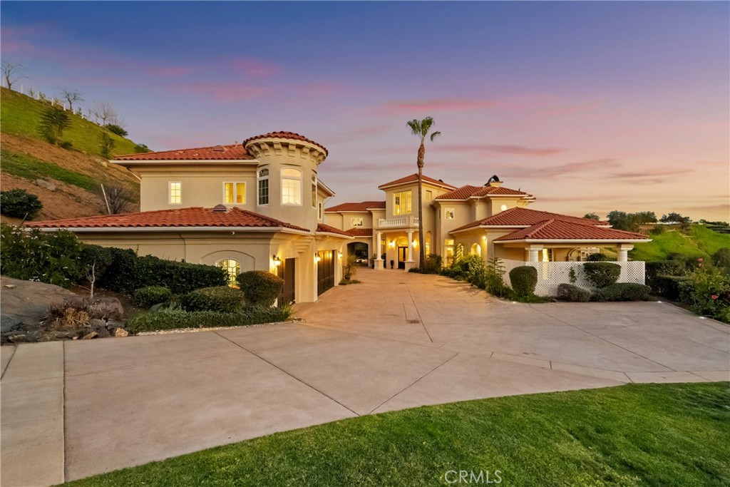 44930 Via Renaissance Temecula, CA 92590 - Photo 3 of 59 a front view of a house with a yard