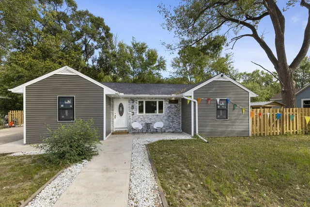 a front view of a house with yard