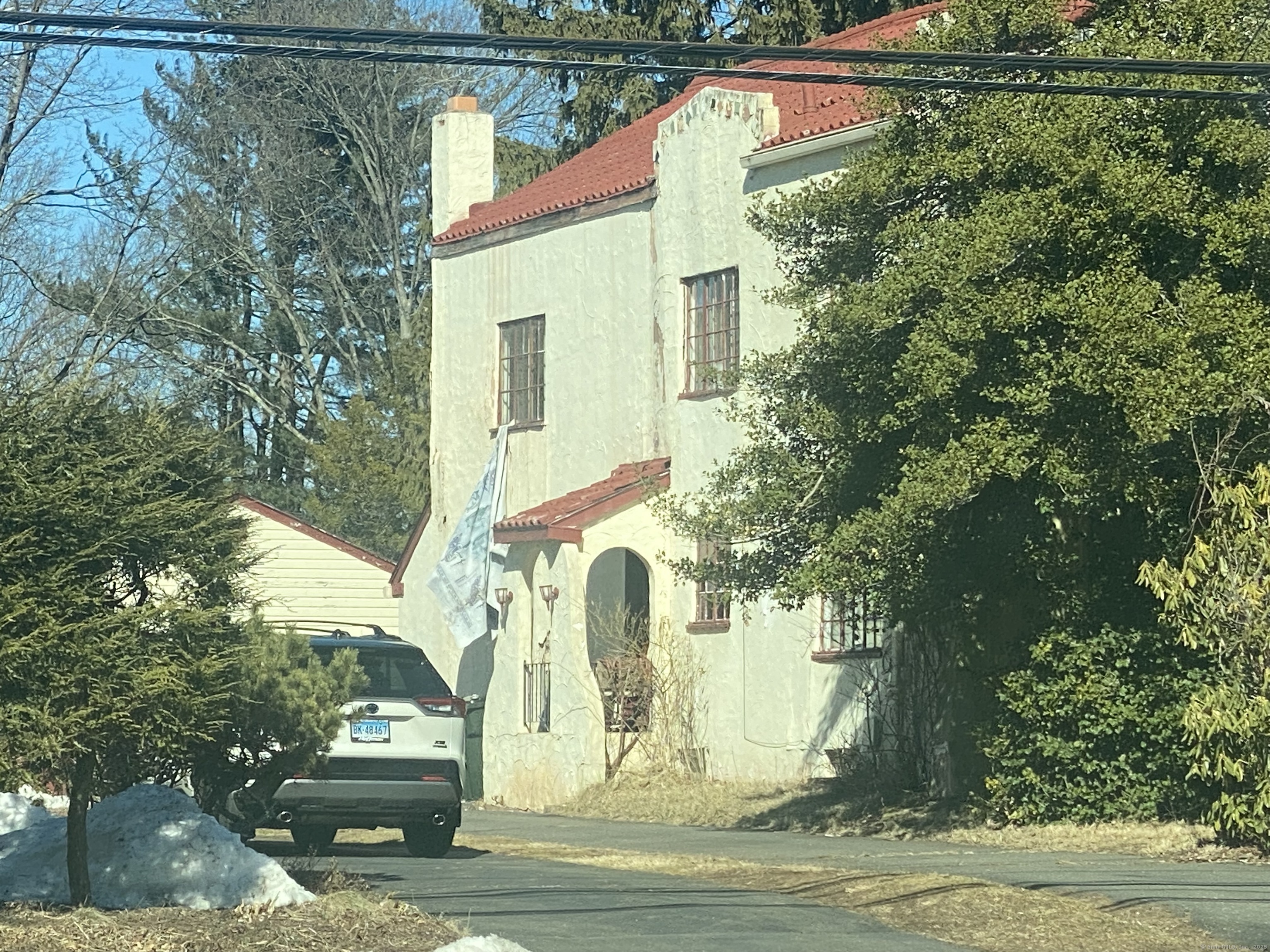 Undisclosed Address West Hartford, CT 06107 - Photo 2 of 7 a view of a house with a yard