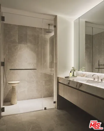 a bathroom with a double vanity sink and mirror