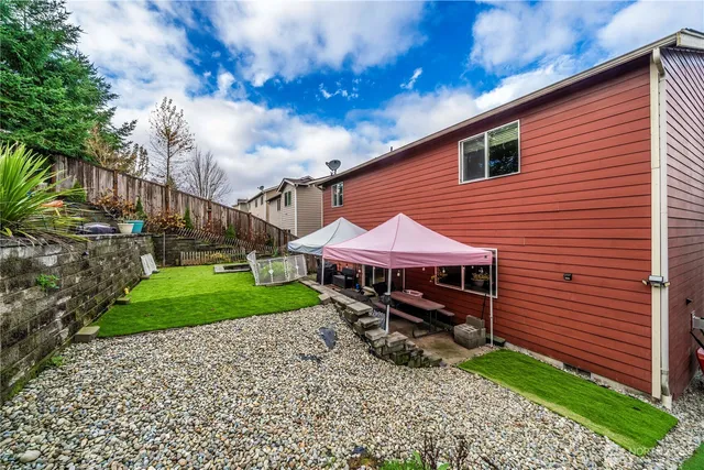 a backyard of a house with lots of green space