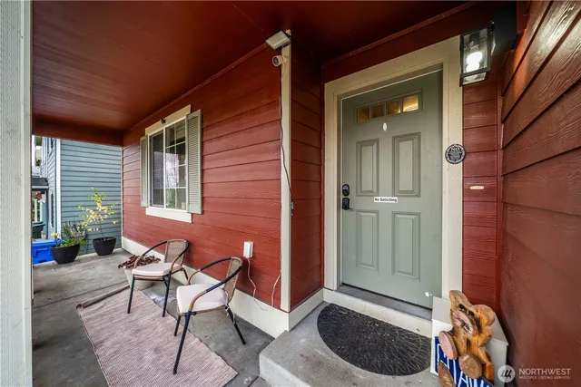 a balcony with furniture and a potted plant