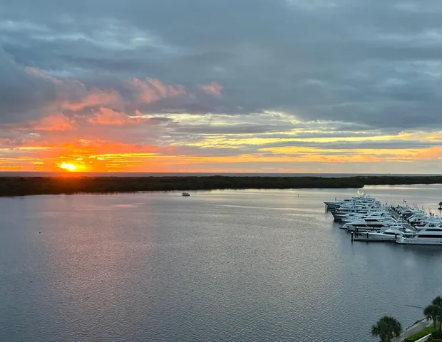 a lobby with furniture and floor to ceiling window