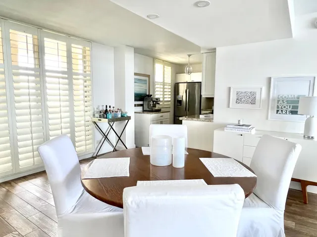 a spacious bathroom with a granite countertop sink and a mirror