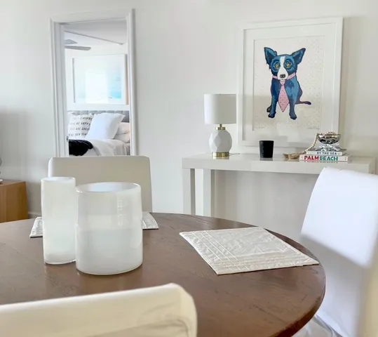 a bathroom with a granite countertop sink a mirror and bathtub