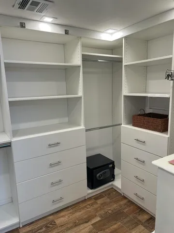 a bedroom with a bed and large window