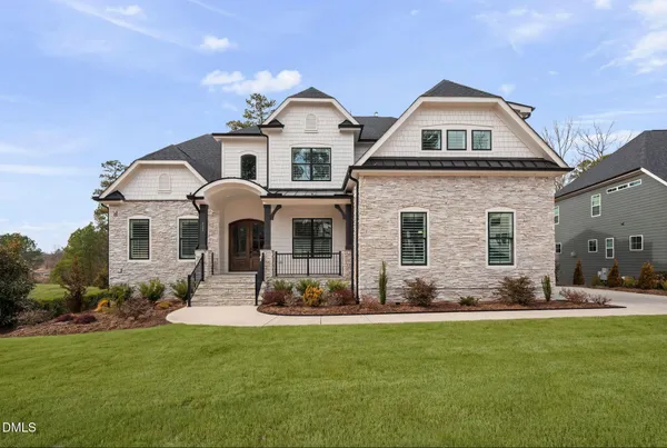 a living room with furniture and view of kitchen