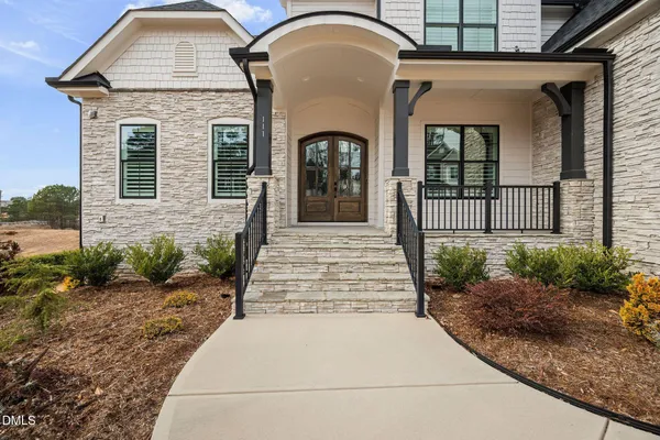 a kitchen with a sink cabinets and wooden floor