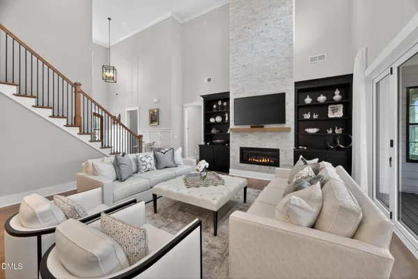 a kitchen with stainless steel appliances kitchen island granite countertop a sink a counter space and wooden floor