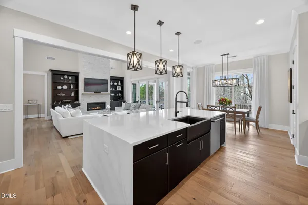 a spacious bedroom with a bed and a flat screen tv