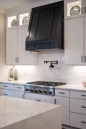 a view of walk in closet with clothes