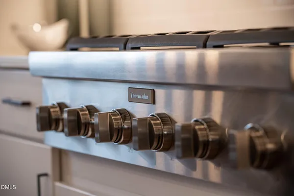 a bathroom with a double vanity sink toilet mirror and shower