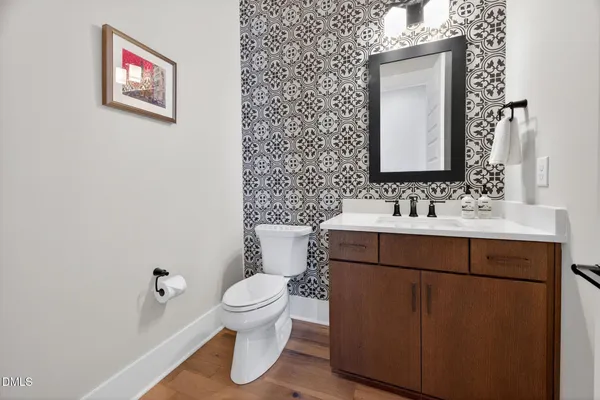 a spacious bedroom with a bed and a walk in closet