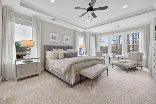 a bedroom with a bed and a flat tv screen