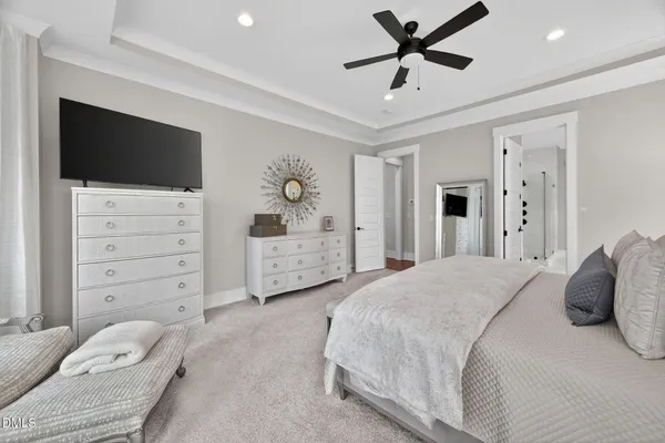 a bathroom with a granite countertop sink mirror and toilet