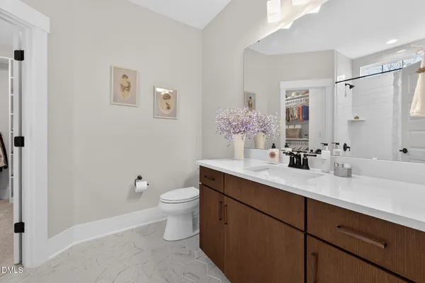 a view of a porch with chairs and floor to ceiling window