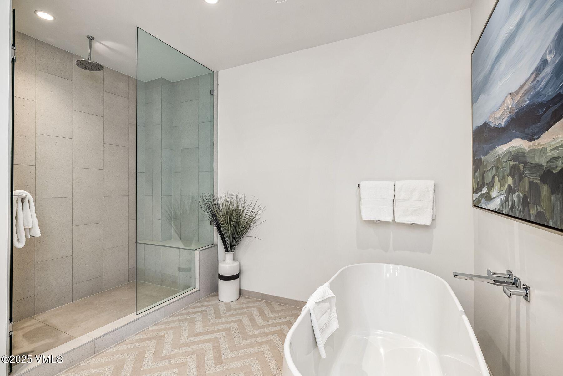 38460 Highway 6, Unit 310 Avon, CO 81620 - Photo 13 of 32 a bathroom with a tub and shower