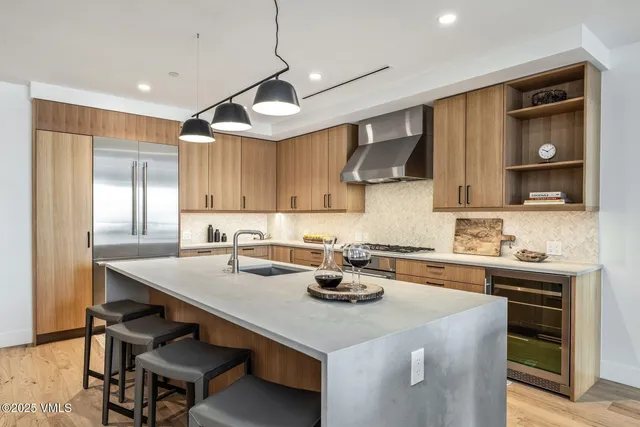 a kitchen with a stove and a refrigerator