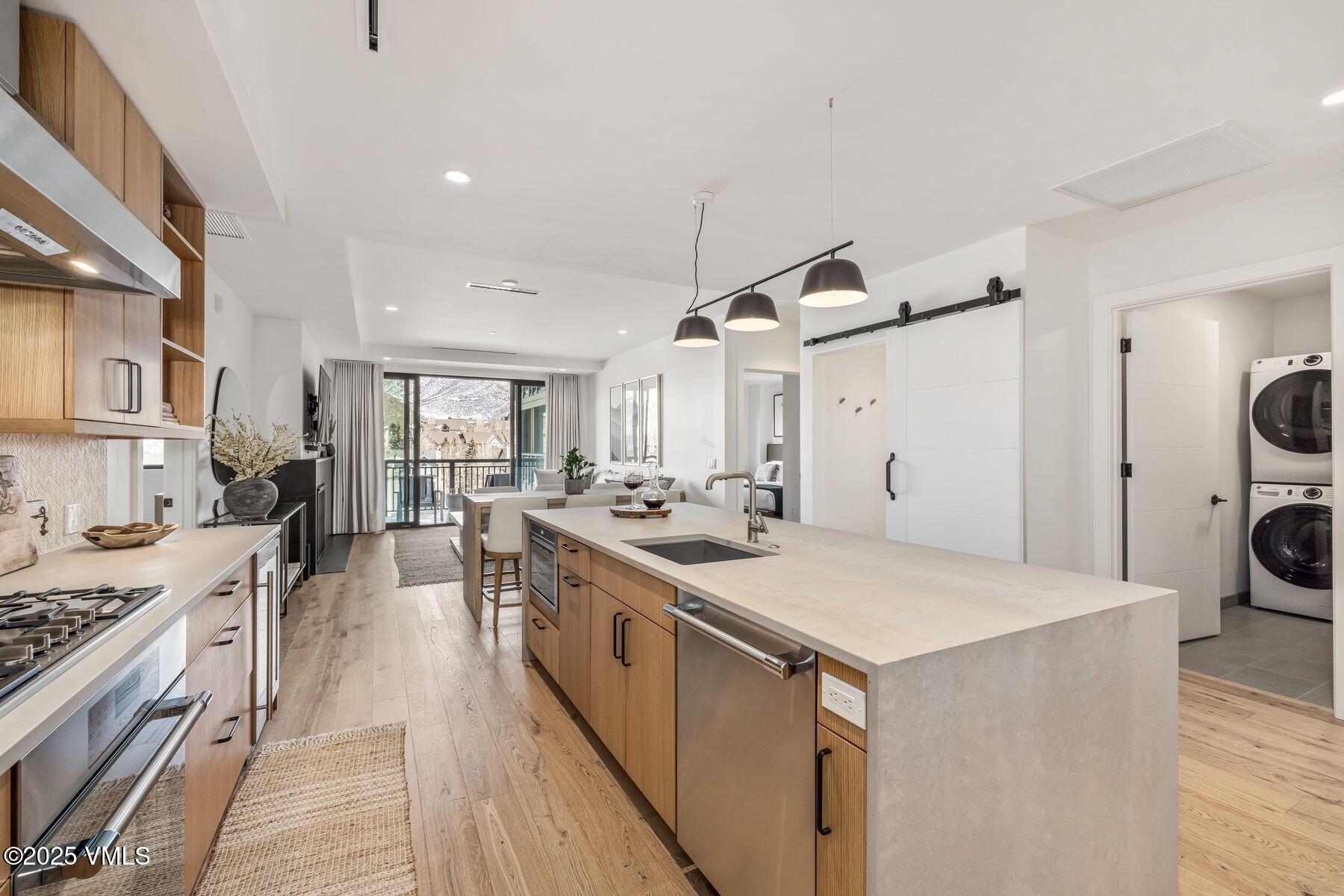 38460 Highway 6, Unit 310 Avon, CO 81620 - Photo 6 of 32 a kitchen with a stove and a refrigerator