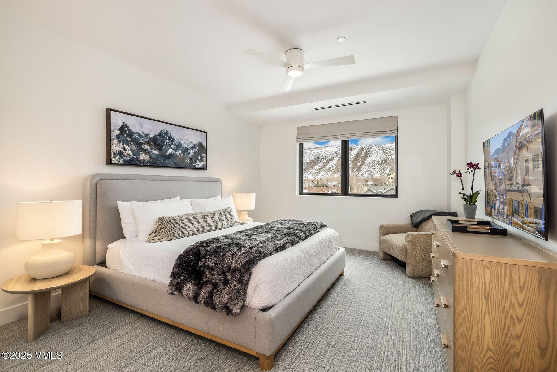 38460 Highway 6, Unit 310 Avon, CO 81620 - Photo 8 of 32 a bedroom with a bed wooden floor and window