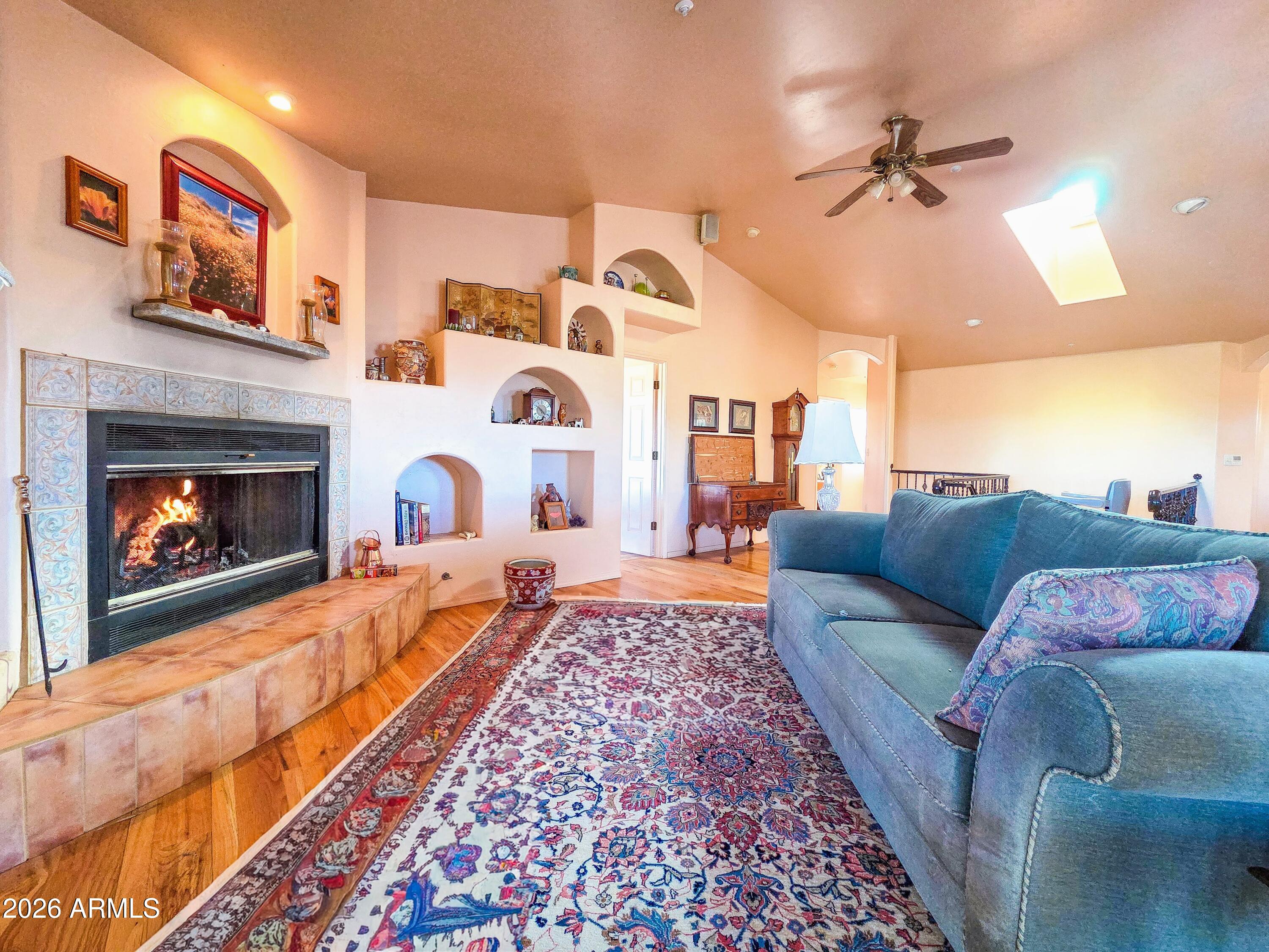 14350 East Meadow Ranch Place Dewey, AZ 86327 - Photo 13 of 54 a living room with furniture and a fireplace